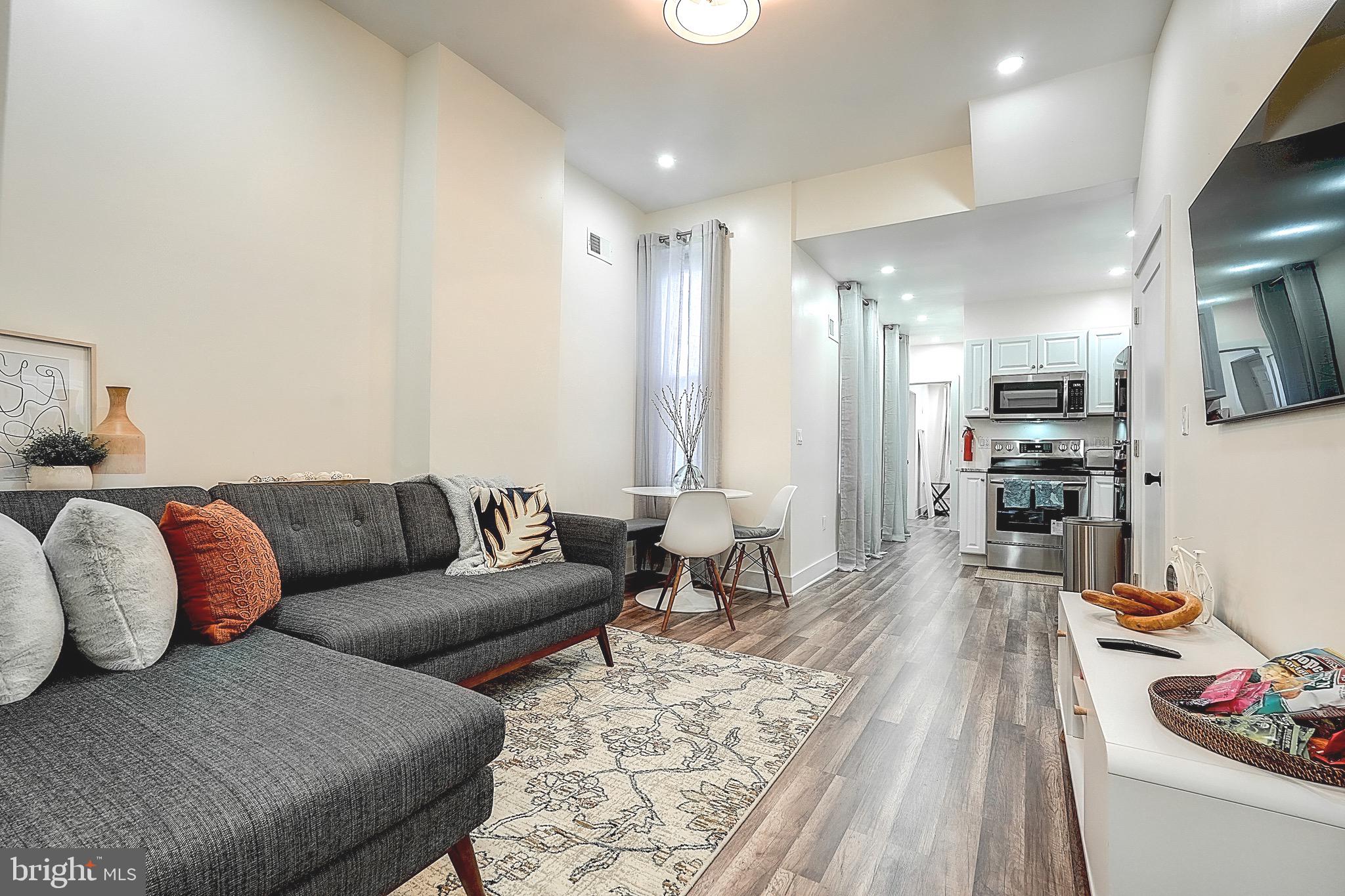 2203 Catharine Street Philadelphia, PA 19146 - Photo 2 of 27 a living room with furniture and a wooden floor