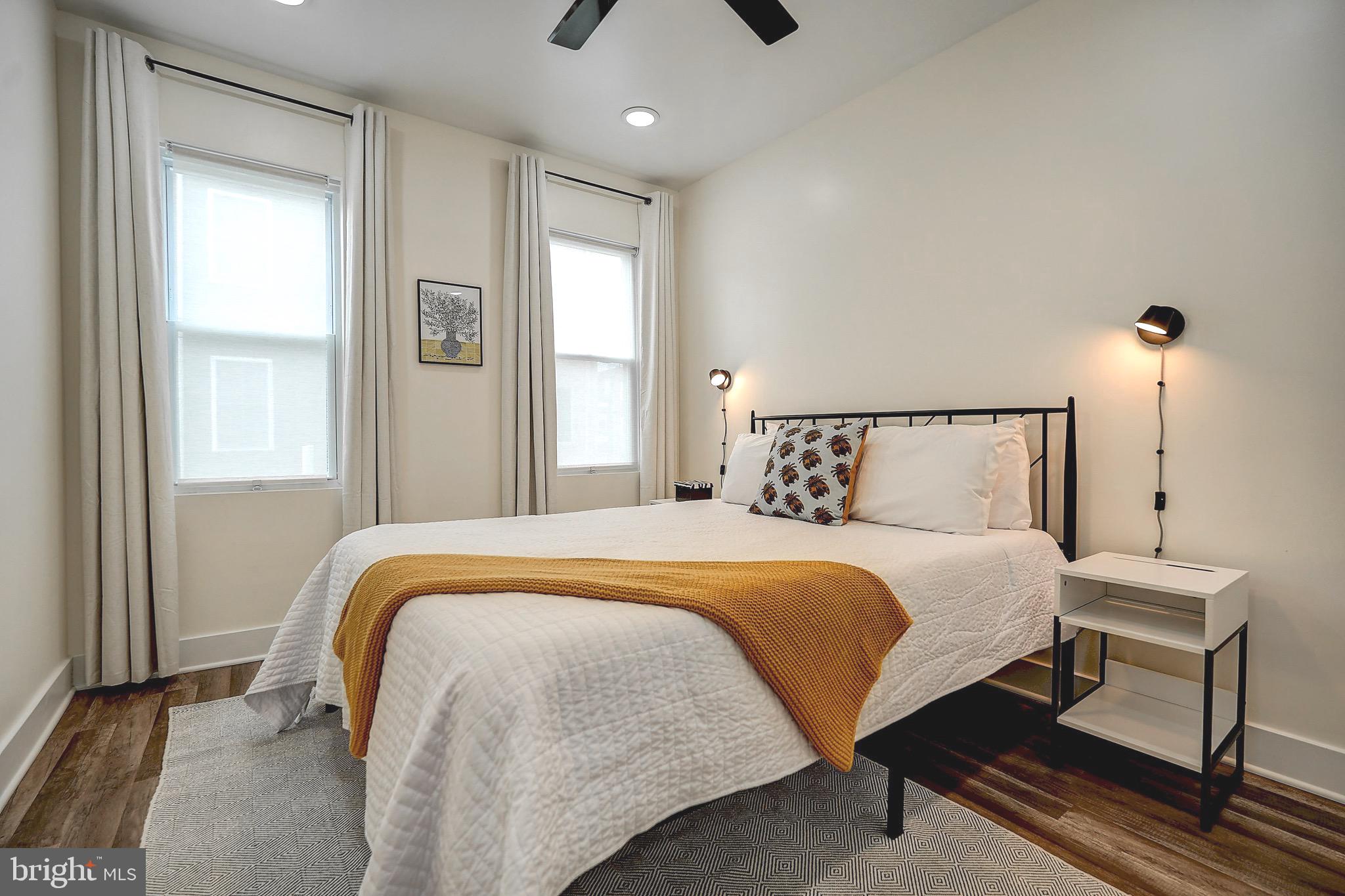 2203 Catharine Street Philadelphia, PA 19146 - Photo 27 of 27 a bedroom with a bed and window