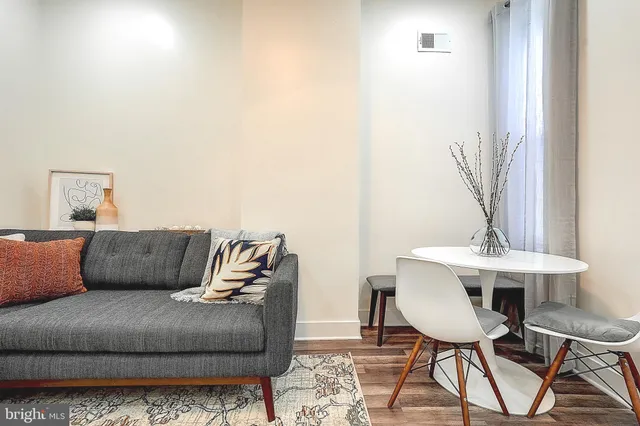 a living room with a couch and a table