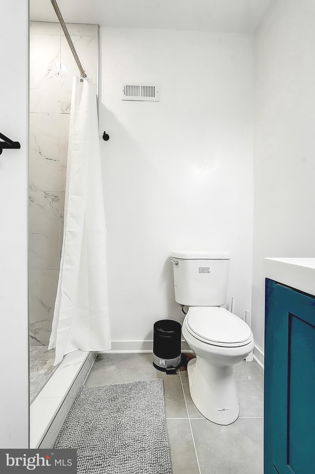 2203 Catharine Street Philadelphia, PA 19146 - Photo 7 of 27 a bathroom with a toilet and a shower