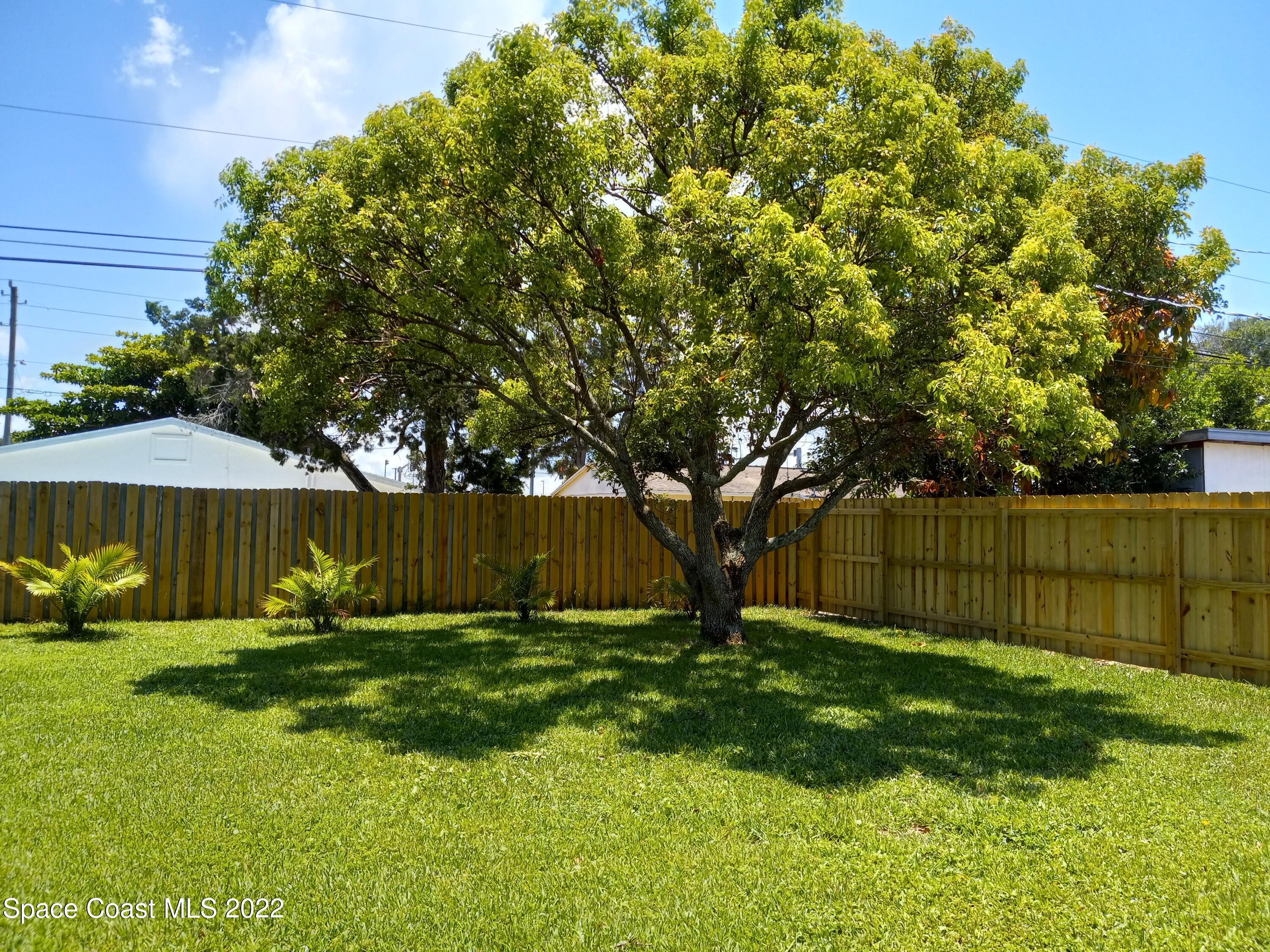 2567 Coventry Road Melbourne, FL 32935 - Photo 3 of 9 a view of backyard with green space