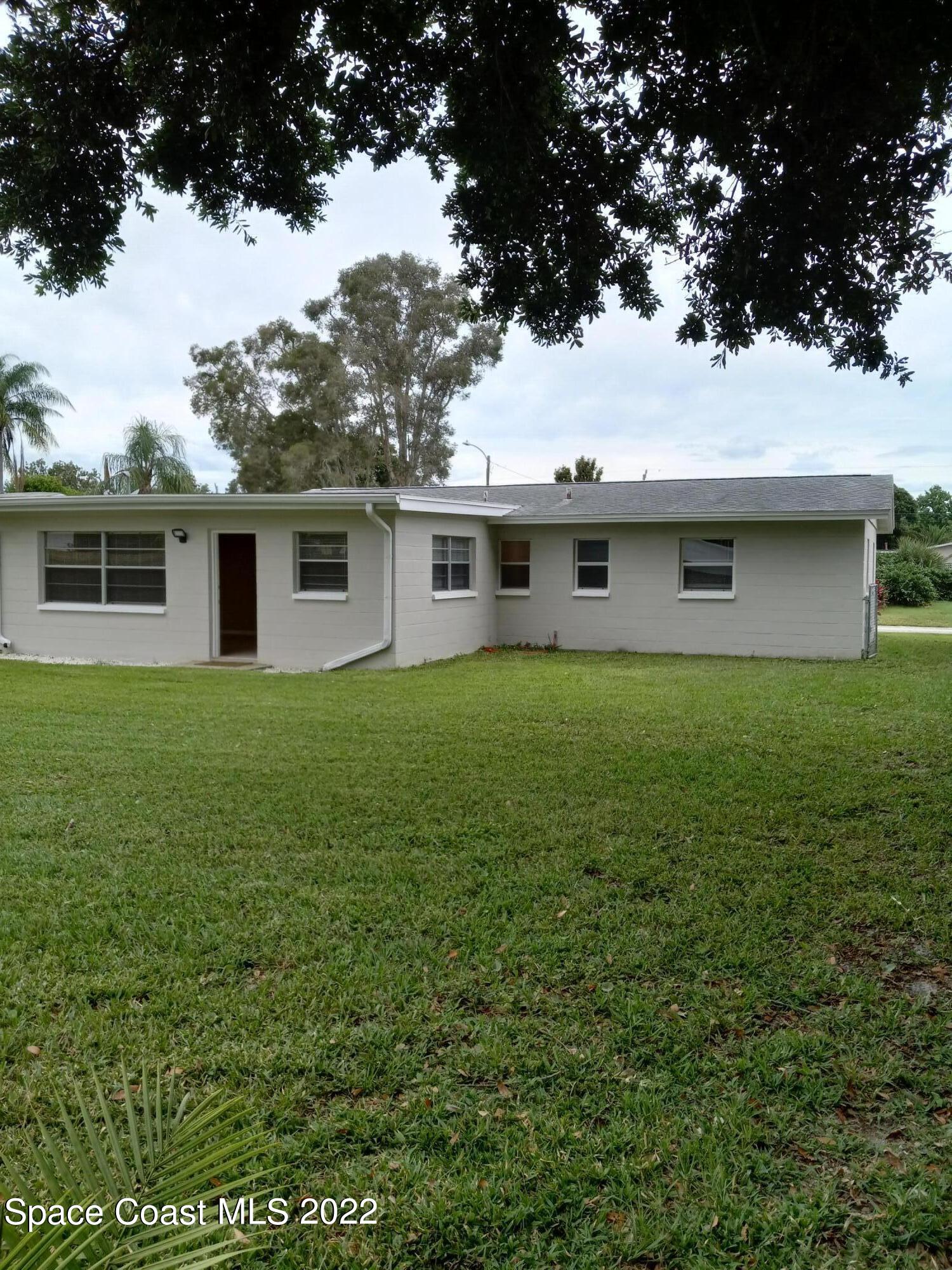 2567 Coventry Road Melbourne, FL 32935 - Photo 7 of 9 a house view with a garden space
