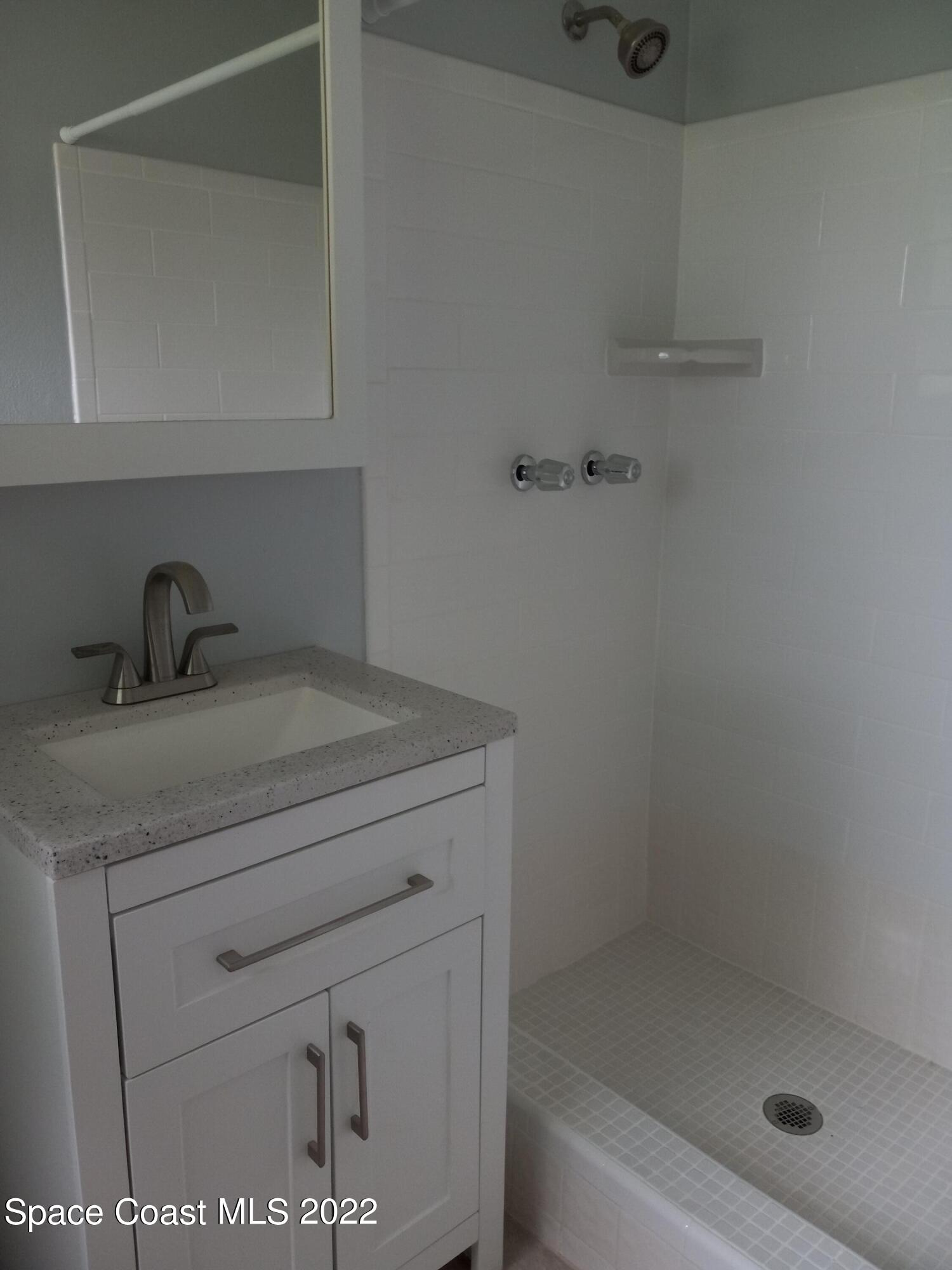 2567 Coventry Road Melbourne, FL 32935 - Photo 8 of 9 a bathroom with a shower
