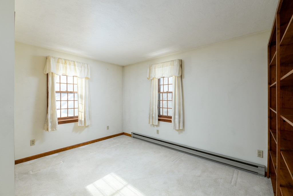 224 Podunk Road Sturbridge, MA 01566 - Photo 17 of 26 an empty room with windows