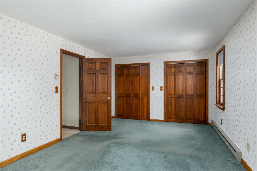 224 Podunk Road Sturbridge, MA 01566 - Photo 19 of 26 an empty room with closet and closet