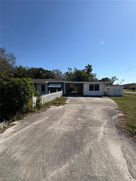 18 Alabama Road North Lehigh Acres, FL 33936 - Photo 1 of 18 a view of lake with a yard