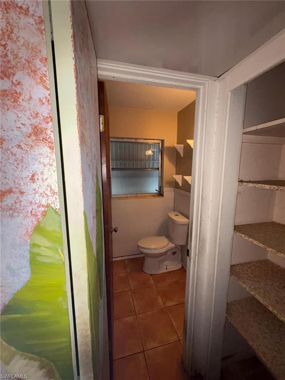 18 Alabama Road North Lehigh Acres, FL 33936 - Photo 12 of 18 a bathroom with a toilet and a shower