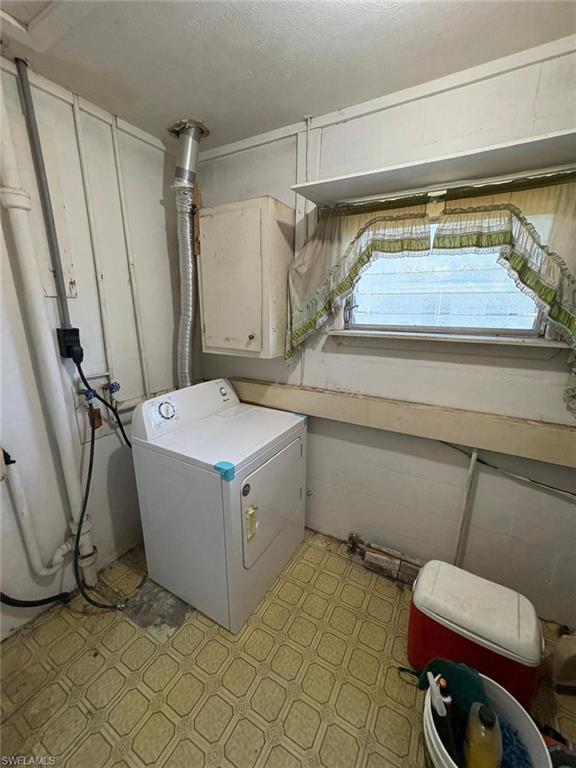 18 Alabama Road North Lehigh Acres, FL 33936 - Photo 17 of 18 a utility room with a washer and dryer