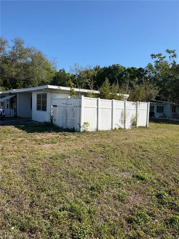 18 Alabama Road North Lehigh Acres, FL 33936 - Photo 2 of 18 a view of a house with a yard
