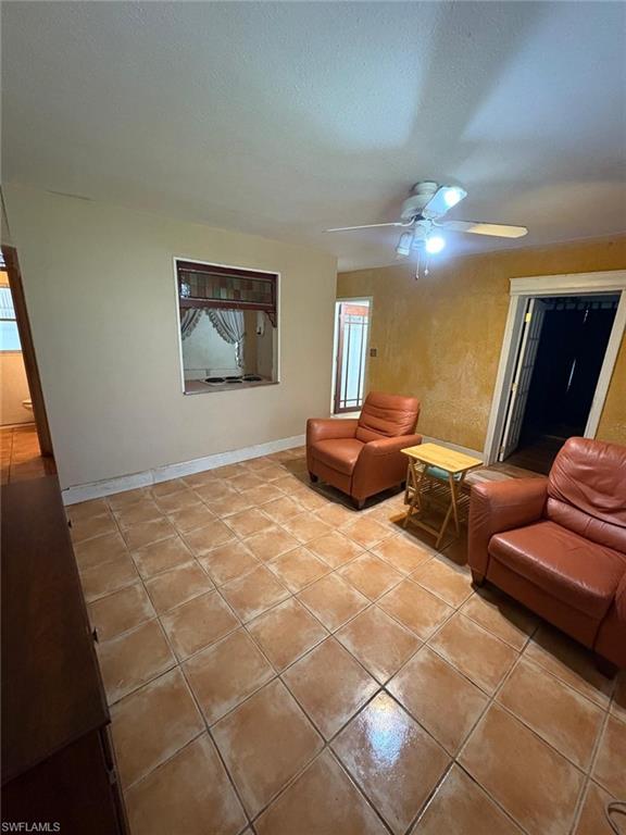 18 Alabama Road North Lehigh Acres, FL 33936 - Photo 7 of 18 a bedroom with furniture and a chandelier