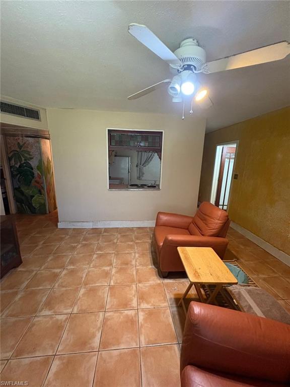 18 Alabama Road North Lehigh Acres, FL 33936 - Photo 8 of 18 a living room with a couch