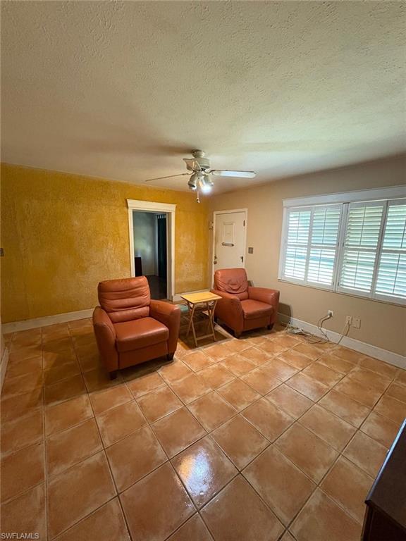 18 Alabama Road North Lehigh Acres, FL 33936 - Photo 9 of 18 a bedroom with a bed and a chandelier