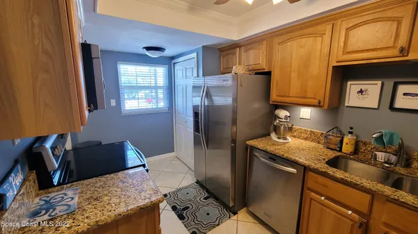 a kitchen with stainless steel appliances granite countertop a stove and a sink