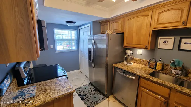 a kitchen with stainless steel appliances granite countertop a stove and a sink