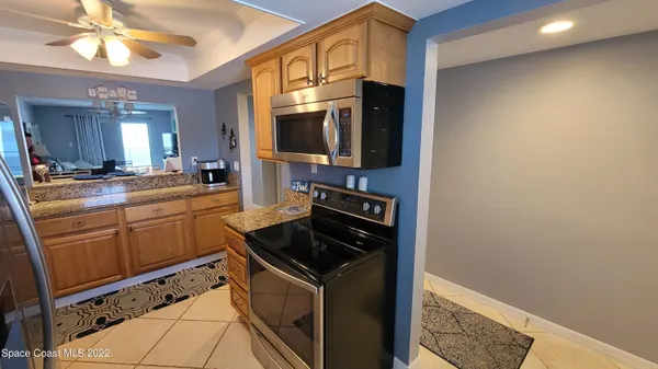 a kitchen with stainless steel appliances a refrigerator a stove a sink and dishwasher