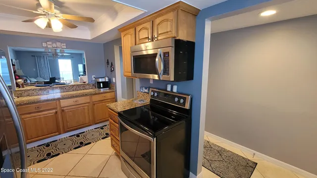 a kitchen with stainless steel appliances a refrigerator a stove a sink and dishwasher