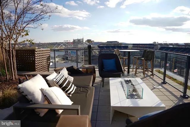 a view of a chairs and table in a patio