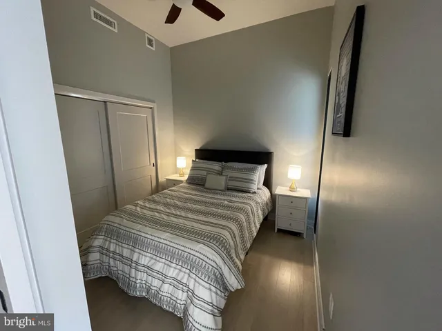 a bedroom with a bed and a walk in closet
