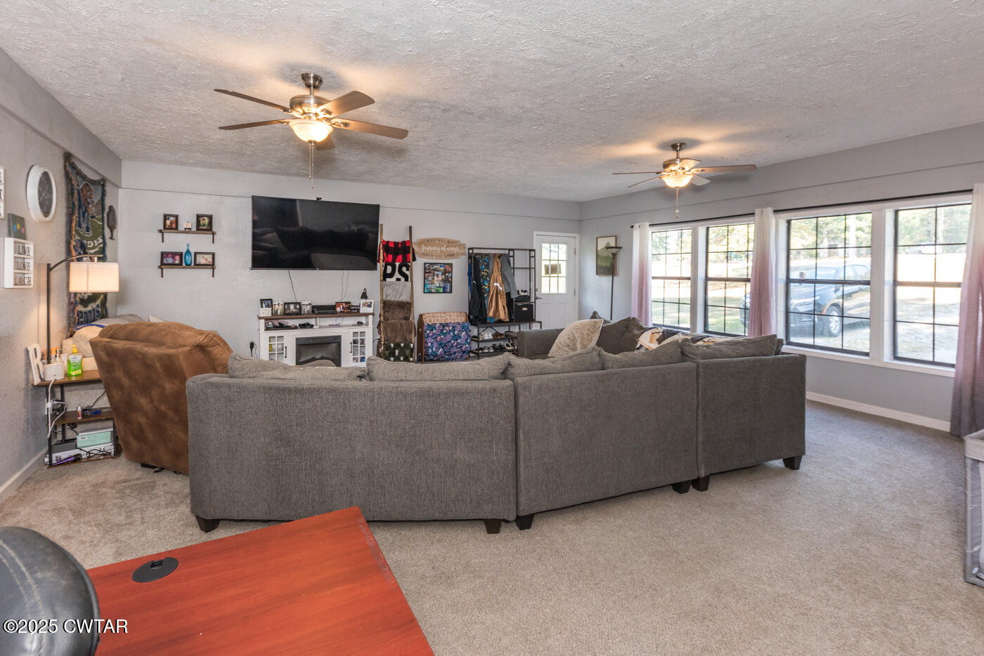 1840 Blue Goose Road Huron, TN 38345 - Photo 12 of 35 a living room with furniture a flat screen tv and a large window