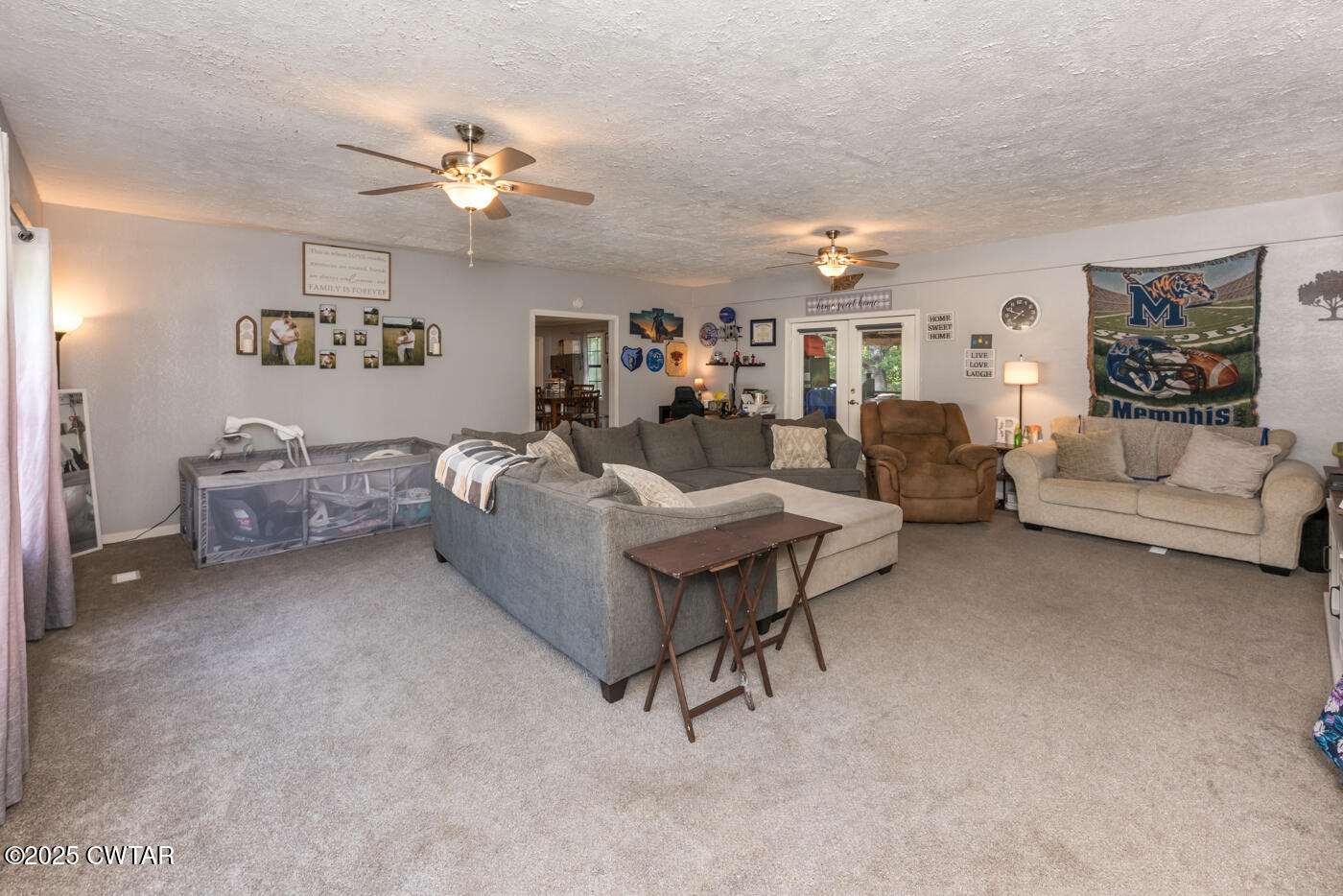 1840 Blue Goose Road Huron, TN 38345 - Photo 14 of 35 a living room with furniture and a chandelier