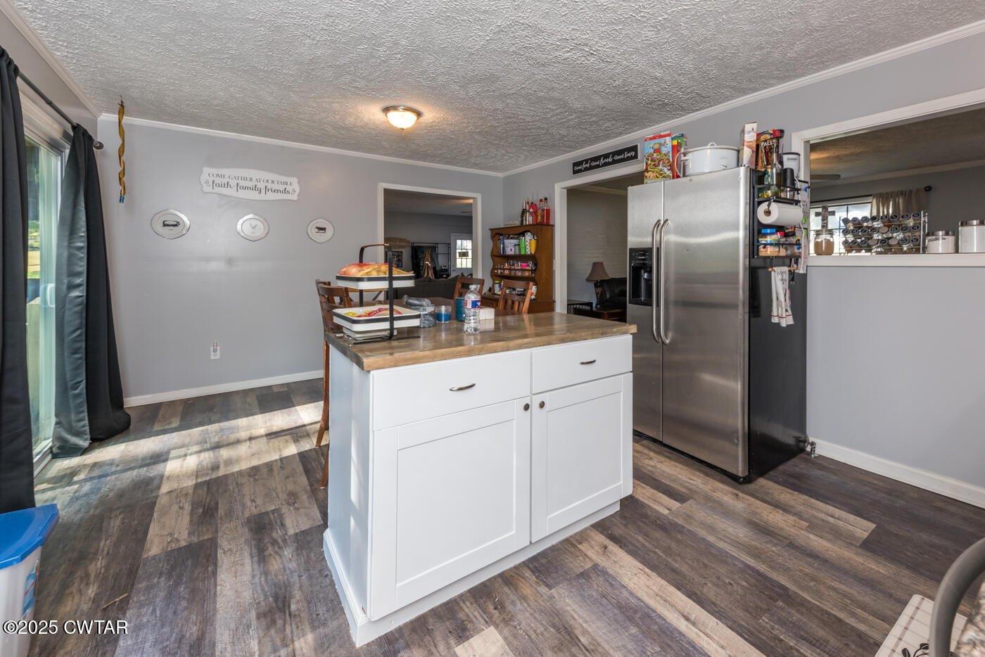 1840 Blue Goose Road Huron, TN 38345 - Photo 18 of 35 a kitchen with stainless steel appliances a refrigerator sink and stove