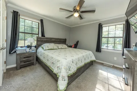 a bathroom with a sink toilet and window