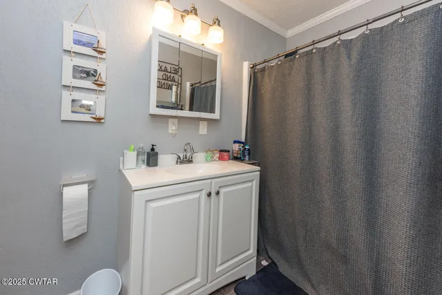 a bedroom with furniture and a chandelier