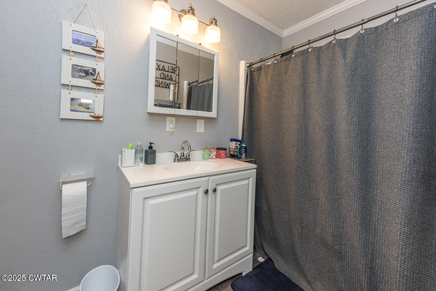 1840 Blue Goose Road Huron, TN 38345 - Photo 22 of 35 a bathroom with a sink and a mirror