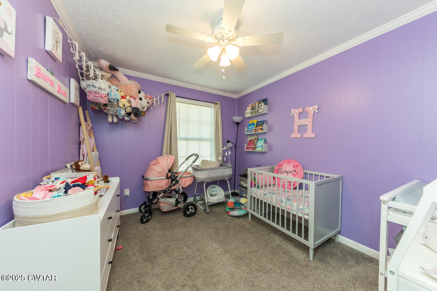 1840 Blue Goose Road Huron, TN 38345 - Photo 23 of 35 a bedroom with furniture and a chandelier