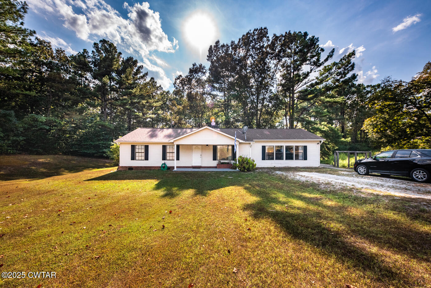 1840 Blue Goose Road Huron, TN 38345 - Photo 33 of 35 a front view of a house with yard and large trees