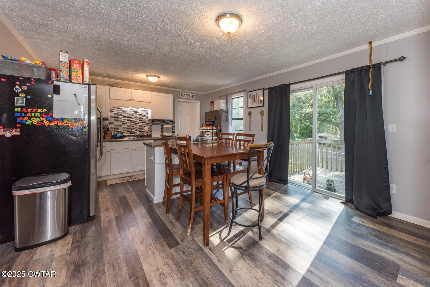1840 Blue Goose Road Huron, TN 38345 - Photo 5 of 35 a view of a dining room with furniture window and wooden floor