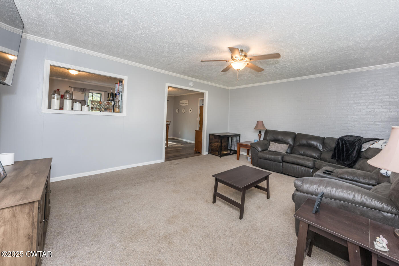 1840 Blue Goose Road Huron, TN 38345 - Photo 8 of 35 a living room with furniture and a ceiling fan