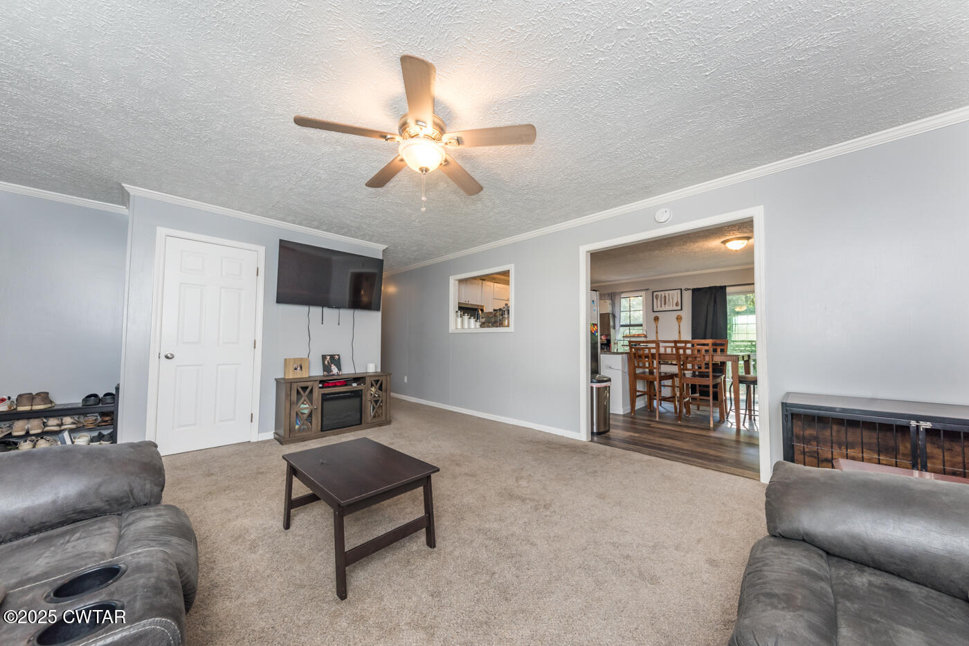 1840 Blue Goose Road Huron, TN 38345 - Photo 10 of 35 a living room with furniture and a flat screen tv