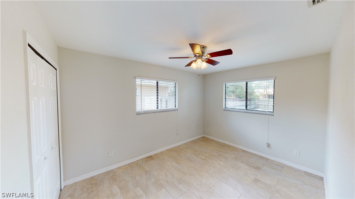 19154 Birch Road Fort Myers, FL 33967 - Photo 18 of 24 a view of a livingroom with a ceiling fan and window