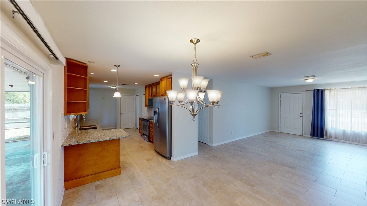 19154 Birch Road Fort Myers, FL 33967 - Photo 4 of 24 a view of a livingroom with furniture and a chandelier
