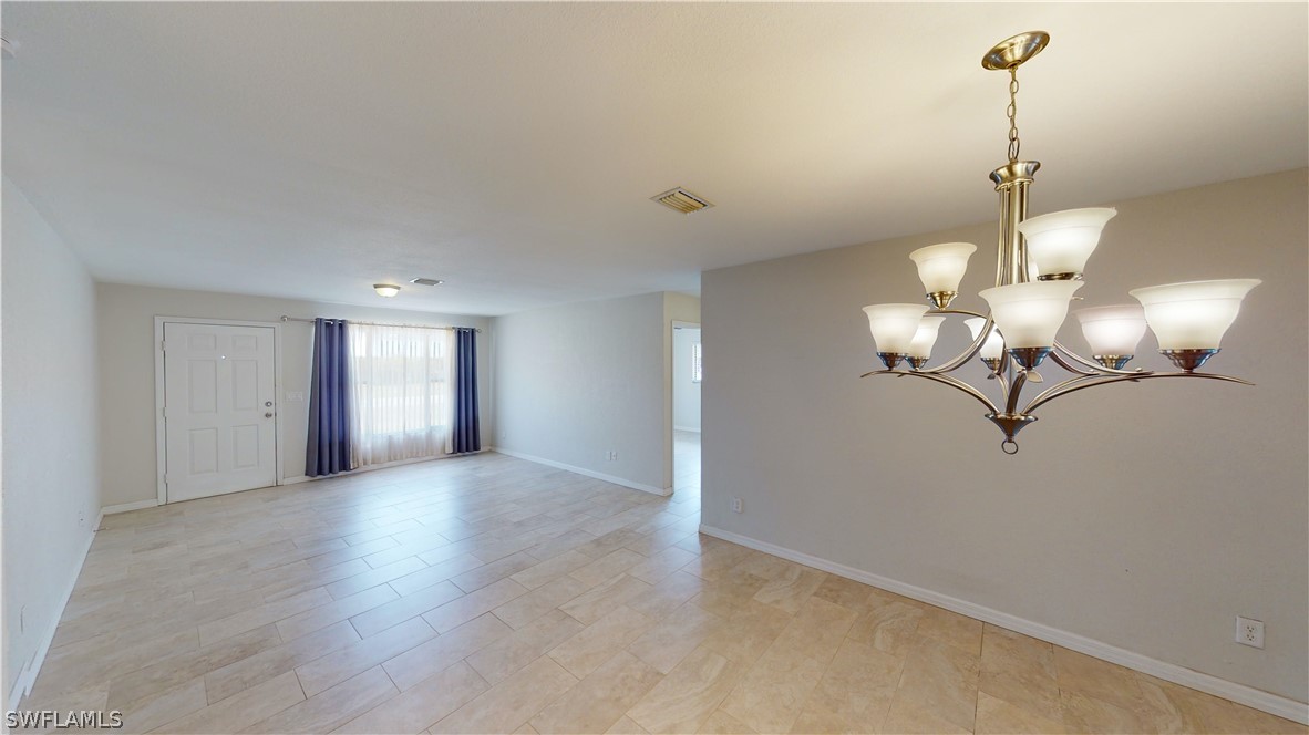 19154 Birch Road Fort Myers, FL 33967 - Photo 7 of 24 a view of a chandelier fan and livingroom
