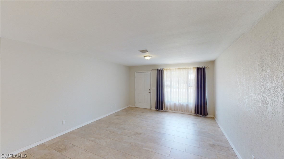 19154 Birch Road Fort Myers, FL 33967 - Photo 8 of 24 a view of an empty room with a window