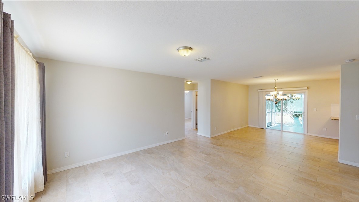 19154 Birch Road Fort Myers, FL 33967 - Photo 9 of 24 a view of an empty room with a window