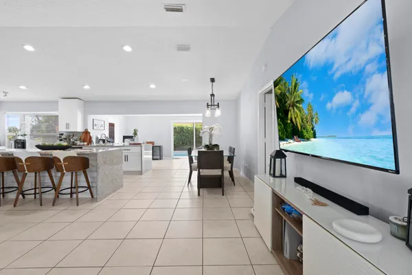 a large kitchen with stainless steel appliances lots of counter top space