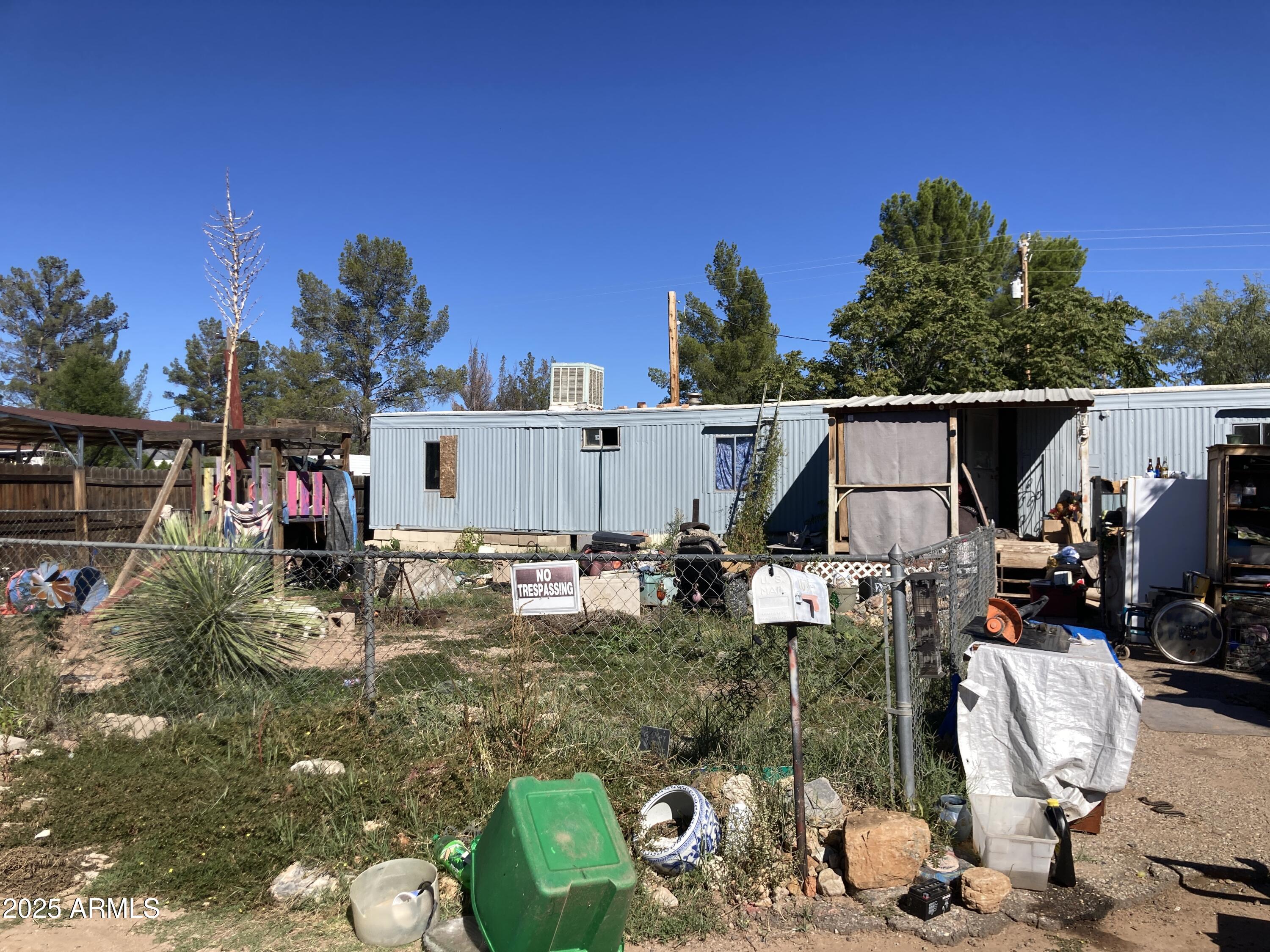 135 East Vía Papaya, Unit 56 Huachuca City, AZ 85616 - Photo 2 of 3 a view of a chairs and tables in patio