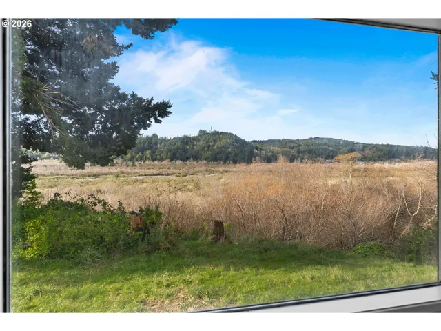 a kitchen with sink cabinets and wooden floor