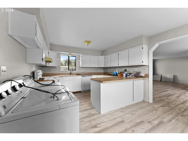 a view of kitchen with wooden floor