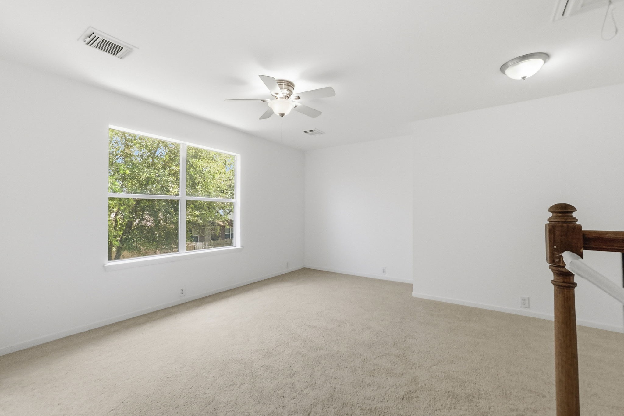 11907 Ezekiel Road Tomball, TX 77375 - Photo 20 of 39 an empty room with a window and a fan