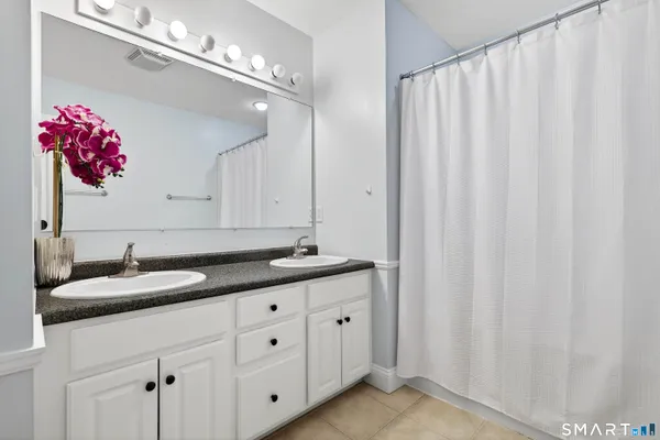 a bathroom with a sink and vanity