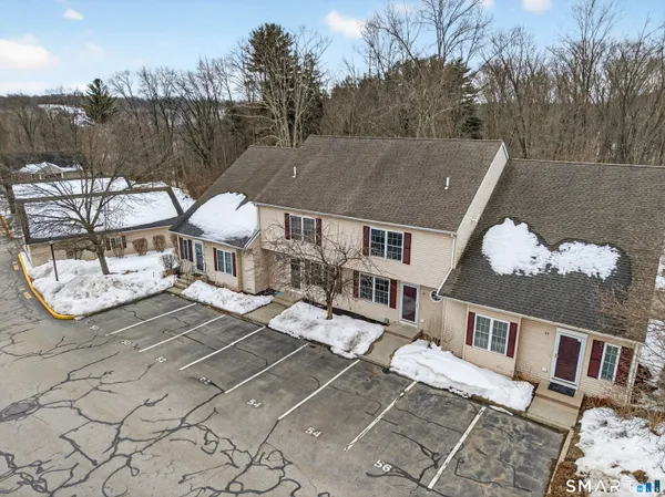 a view of a house with swimming pool and sitting area