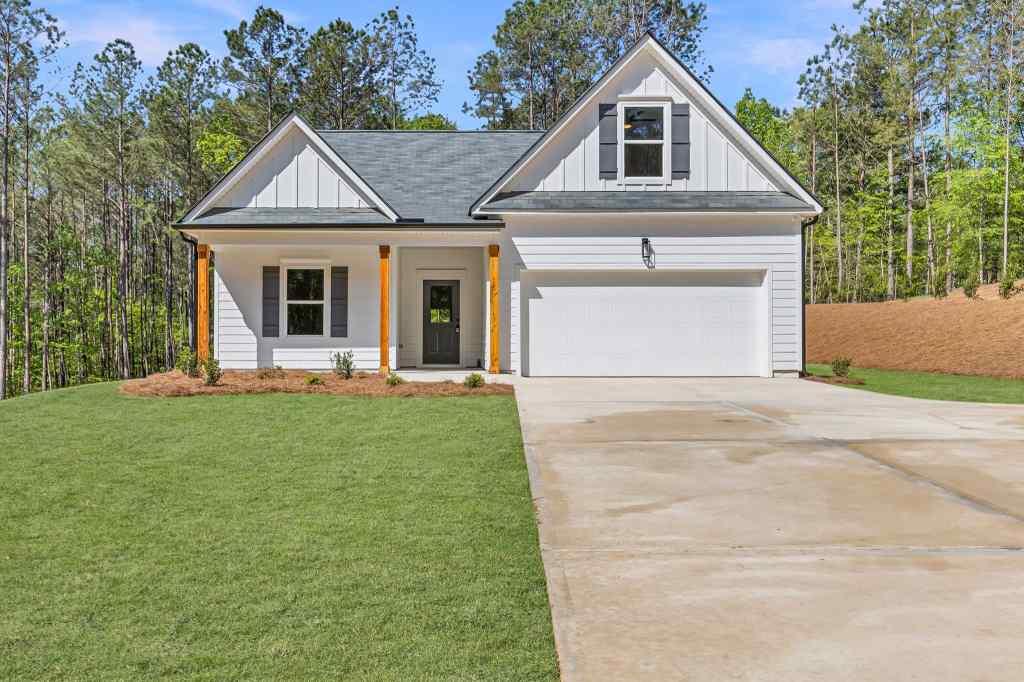 a front view of a house with yard