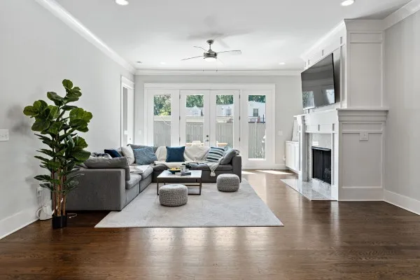 a living room with furniture fireplace and flat screen tv