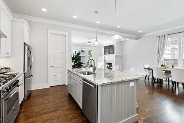 a bathroom with a granite countertop tub sink and mirror