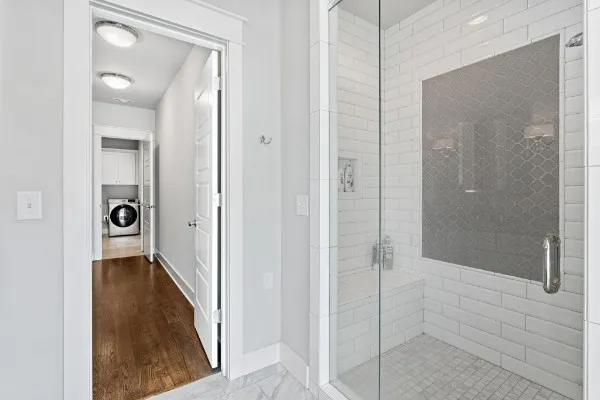 a en suite bathroom with a granite countertop sink and a mirror