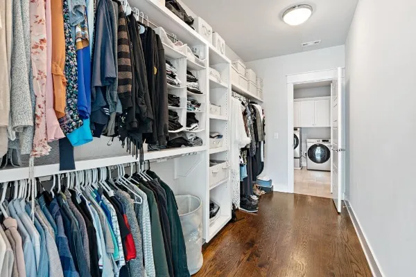 a white toilet sitting next to a shower curtain